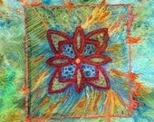 A fiber art wall hanging Celtic Blue in turquoise, blue green & orange highlights
