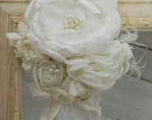the LISETTE Soft Ivory Boutique Couture Style Layered Flower and Rosette Stretch Lace Headband