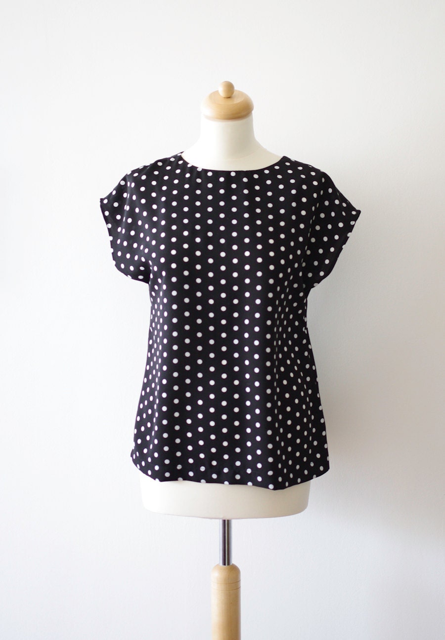 Polka dots blouse, white dots on black.