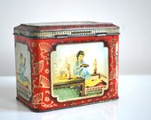 Vintage red tin tea caddy in red and gold, decorative tin box.