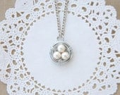 white pearl wire wrapped bird nest necklace