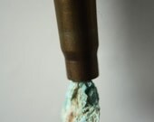 Turquoise colored stone bullet shell necklace