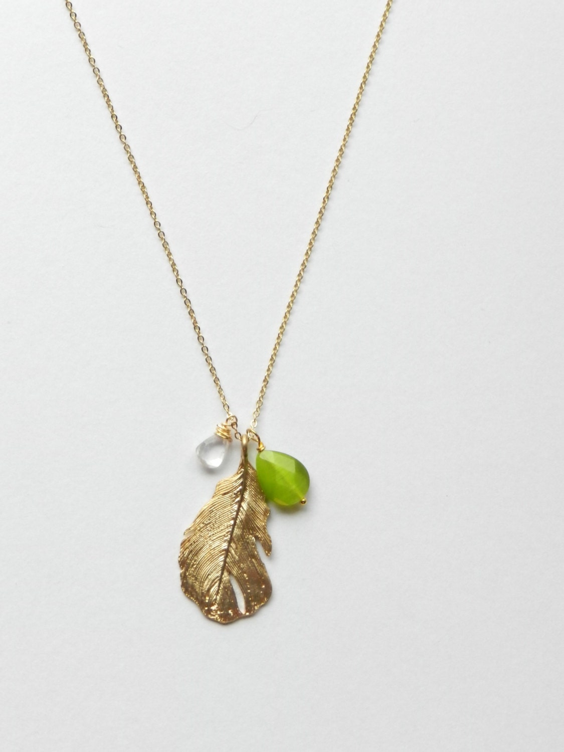 Gold Feather and gemstone necklace.