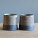 black cup pair. black stoneware white glaze. modern minimal ceramic pottery