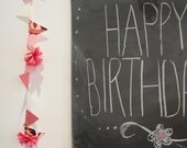pink, red, white garland with hanging pink flowers