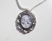Alice in Wonderland necklace, Alice at the Tea Party, John Tenniel Illustration in black and white.