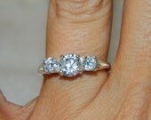 Three stone engagement ring