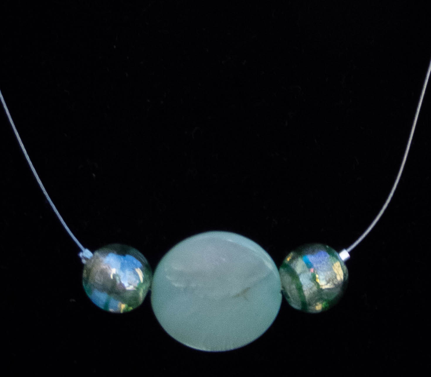 Green, Floating: A short invisible cord statement necklace
