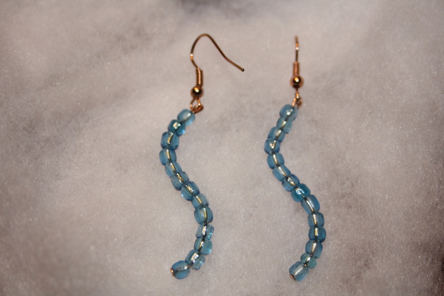 Peace Like A River Blue Curved Beaded Earrings