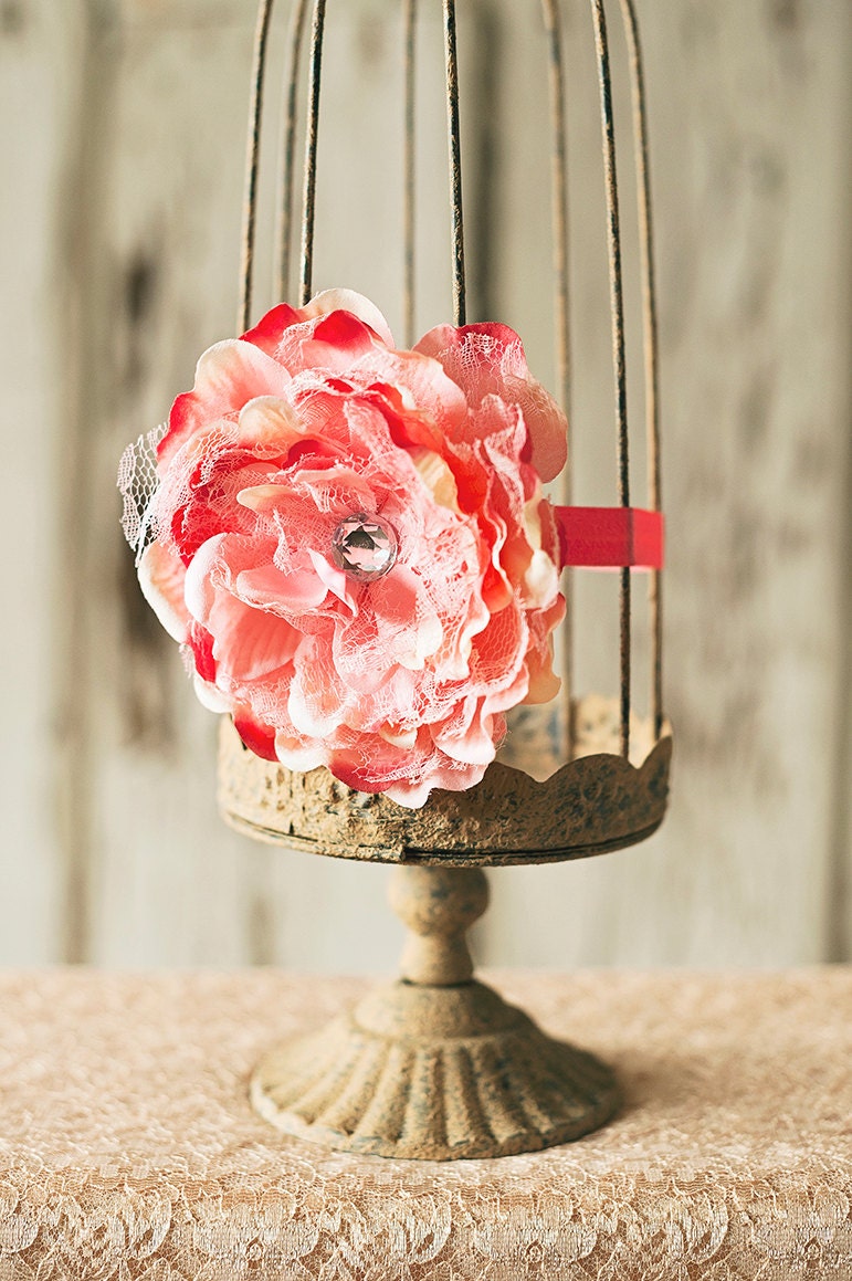Large coral pink lace flower on a coral baby girl toddler children's headband