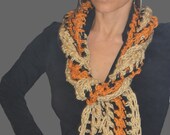 Crocheted, handmade, one of a kind beige and burnt orange w / black trim scarf.