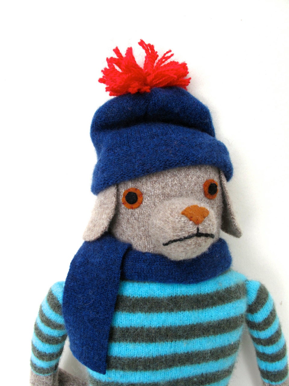 Beige Dog doll in Striped Sweater and Hat