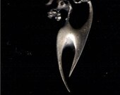 Vintage Silver Poodle Abstract Pin with Red Crystal Eyes