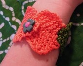 Orange and green knitted cuff bracelet
