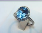 3.18 Carat 10 X 8mm. Natural Swiss Blue Topaz set in a 14k White gold ring with diamonds (.33ct) Ring 0317