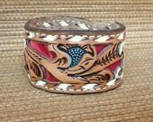 One of a kind Hand tooled Leather cuff with red velvet background.  Colorful, Feminine