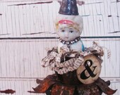 nesting: assemblage bird frozen charlotte on blue vintage oil can