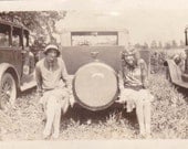Great Photo of 2 Woman Posing on Back of Car