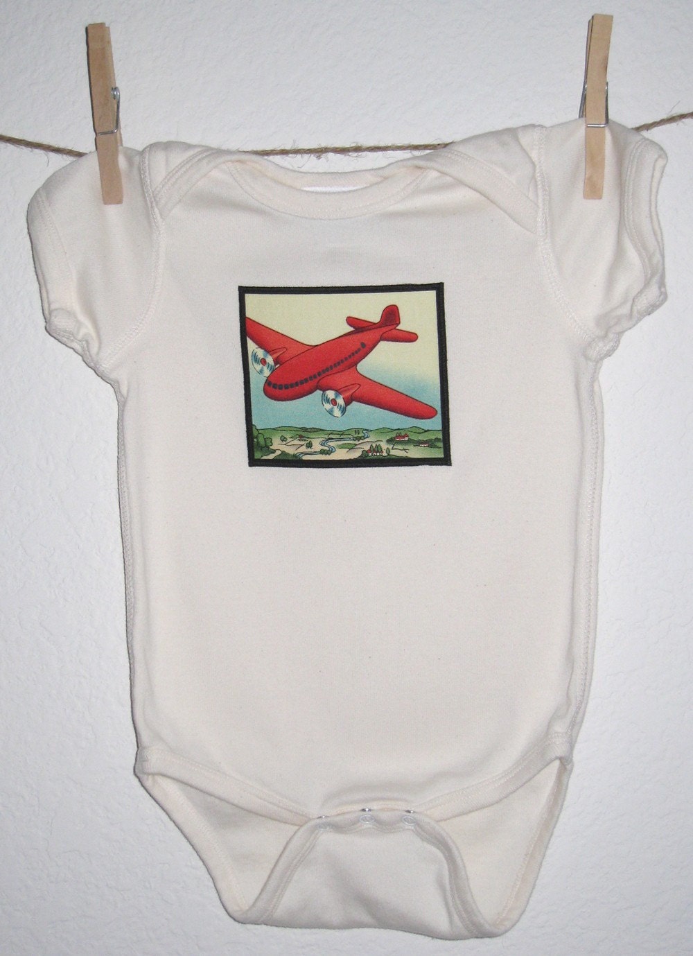 Traveler's Red Airplane organic cotton onesie