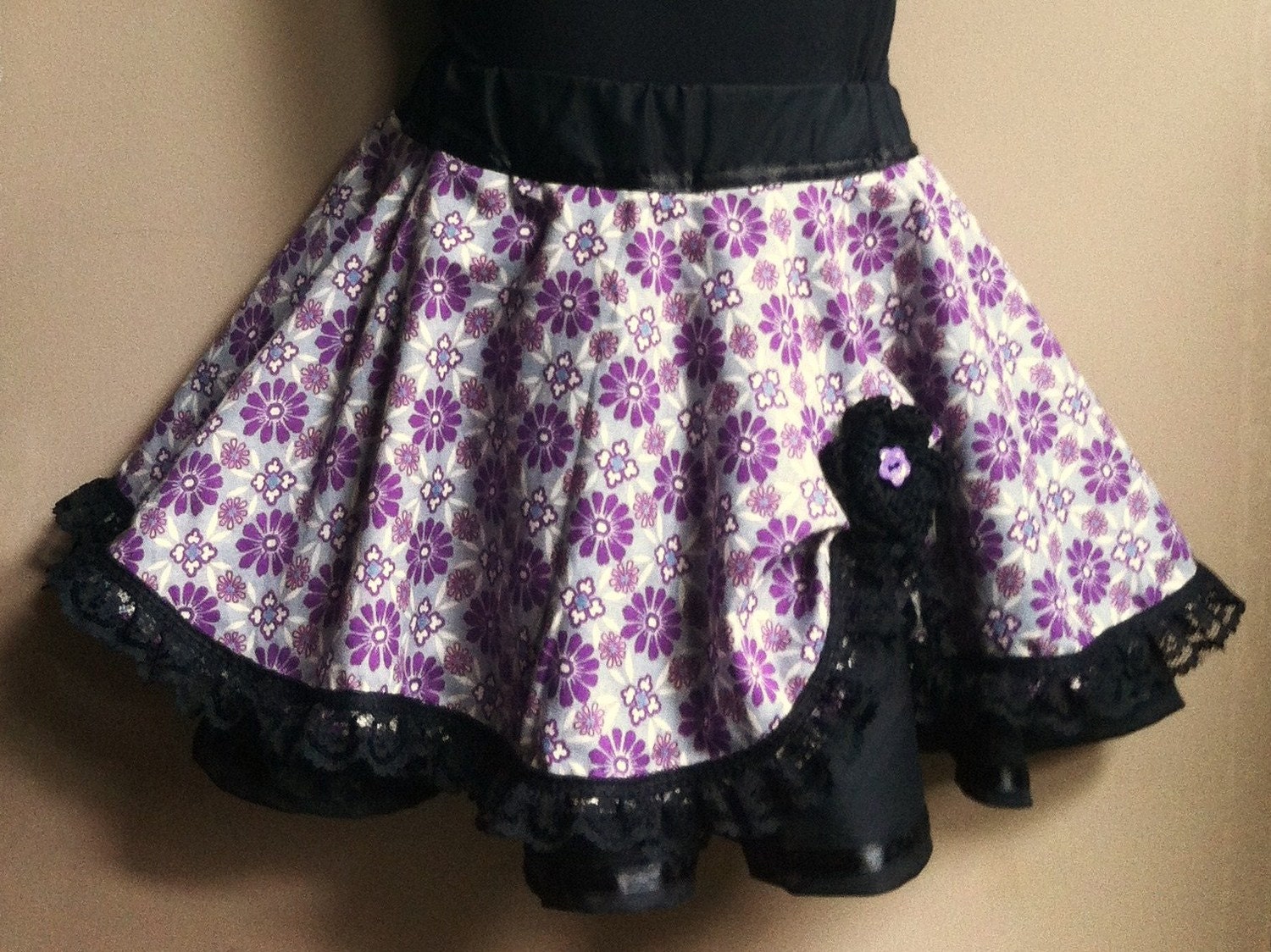 Layered black and purple skirt with black gothic lace and a crochet flower.