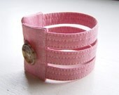 Cuff bracelet pink textured fabric with detail stitching