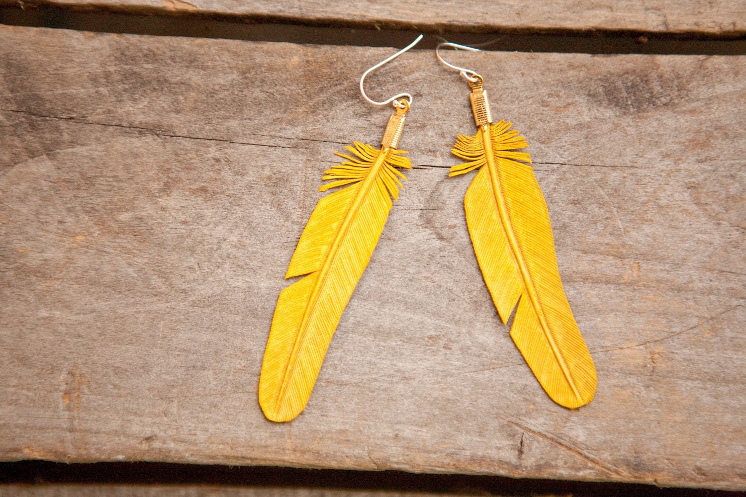yellow hand-carved leather feather earrings