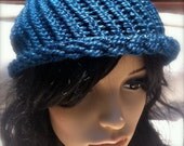 Knit hat in teal by Lucky Charm Fancy