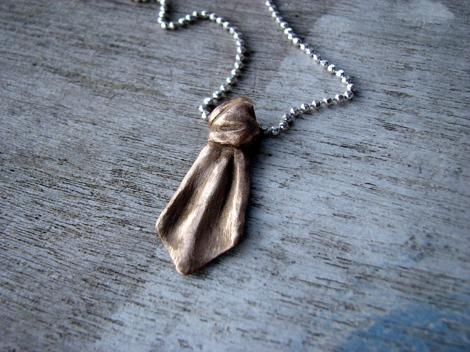 Necktie pendant sculptured bronze