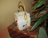 Biscuit or Cracker Jar and Wicker Handle ad Bird Motiff