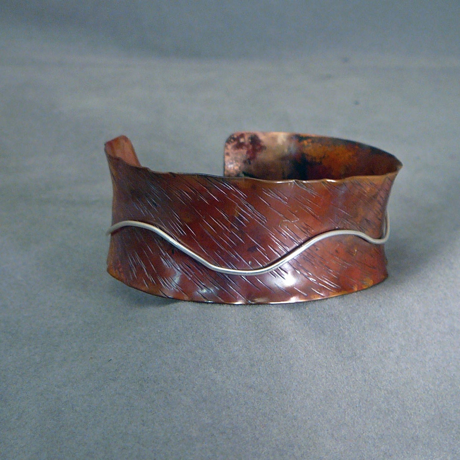 Copper and sterling silver flared bracelet