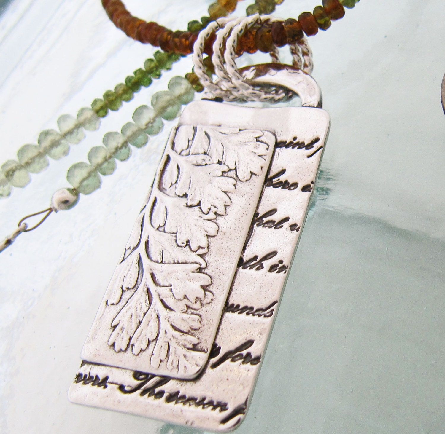 Silver Fern and Script on Petro Tourmaline