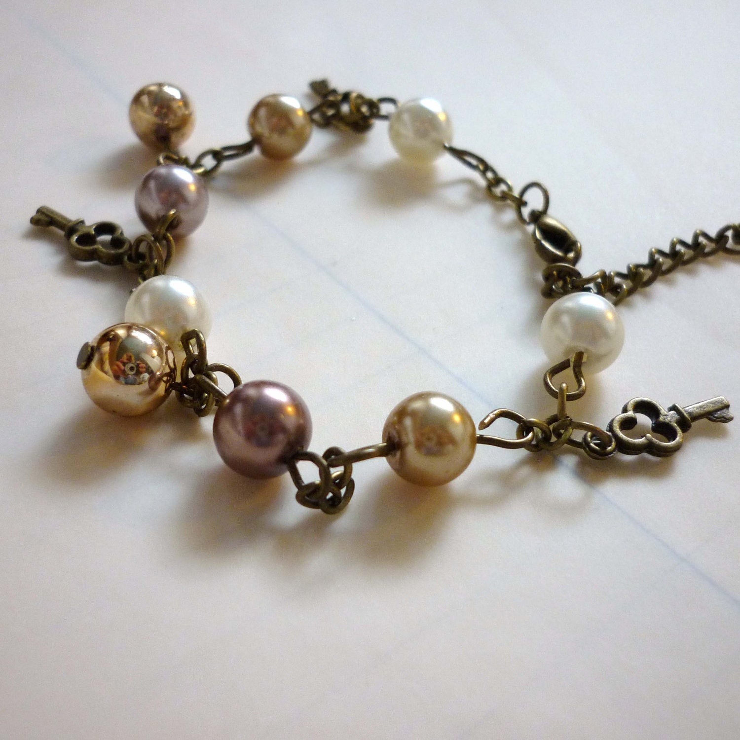Bronze "Locked" Charm Bracelet with Cream, Chocolate, Pink and Gold Faux-Pearl Beads and Key Charms