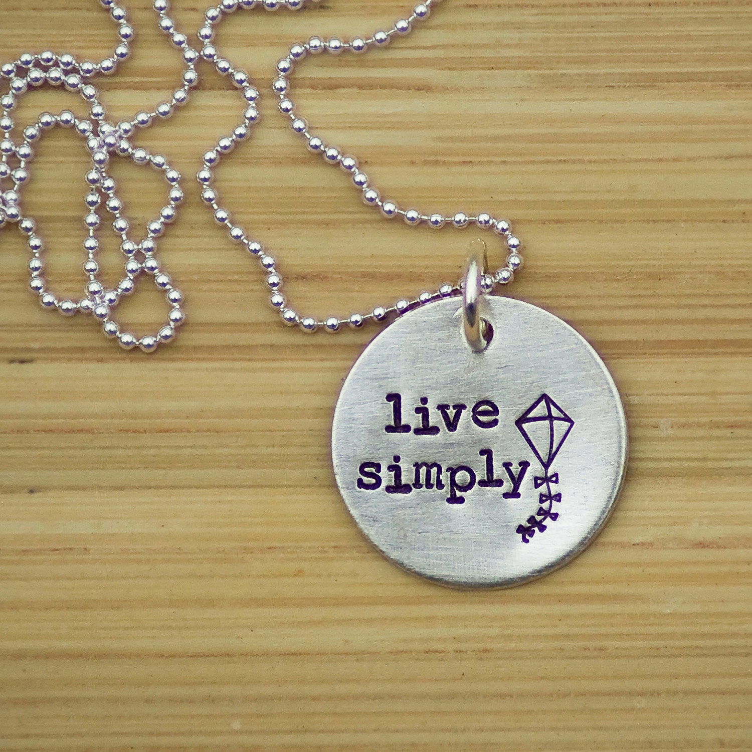 Hand Stamped Sterling Silver Live Simply kite necklace by Tag Youre It Jewelry