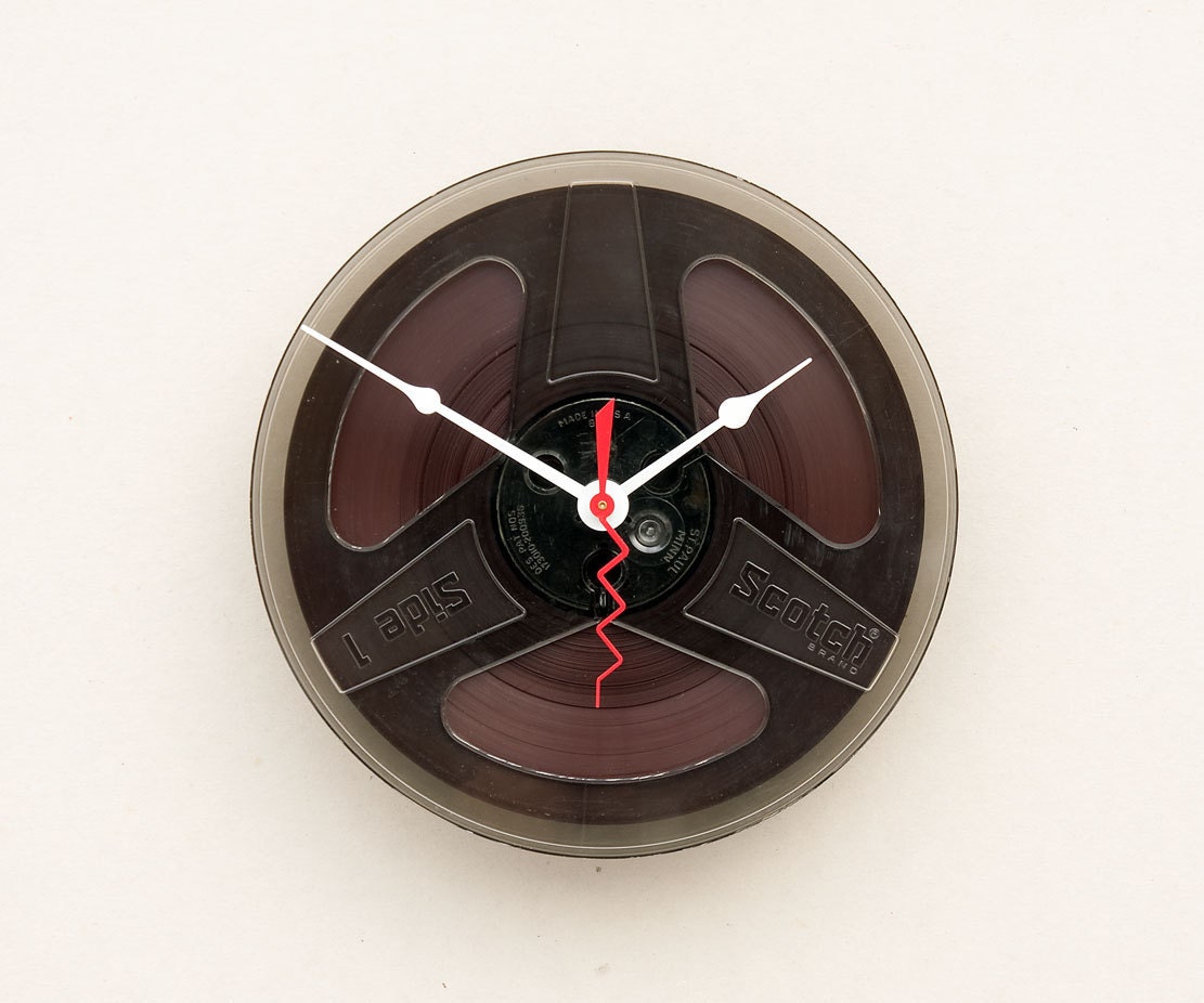 Clock made from a recycled magnetic tape reel