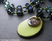 Green Egyptian Eye Pendant. Black and Blue Beaded Necklace with Lime Tagua Shell Charm