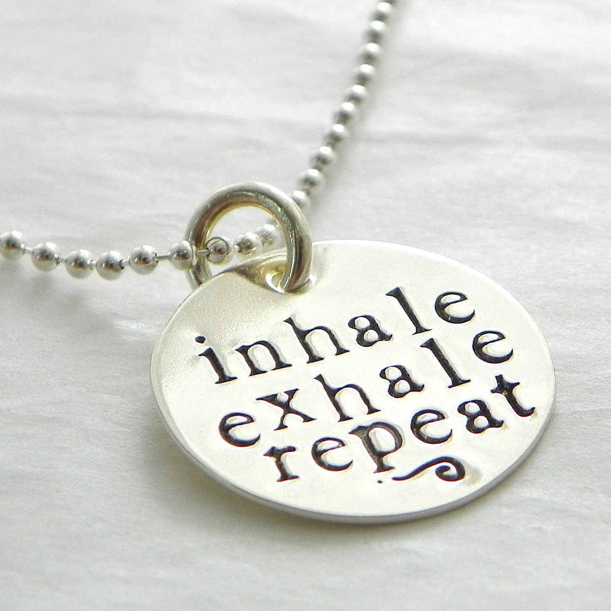 inhale exhale repeat hand stamped sterling silver necklace