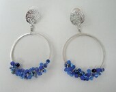 Silver Hoop wired with blue swarovski crystals, glass seed beads and silver open work ear pad with sterling silver post.