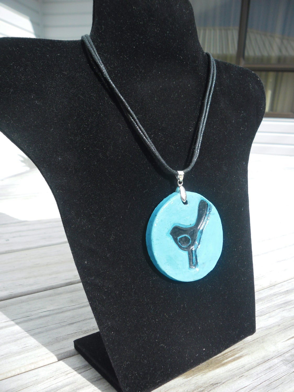 Polymer clay pendant featuring pukeko bird.