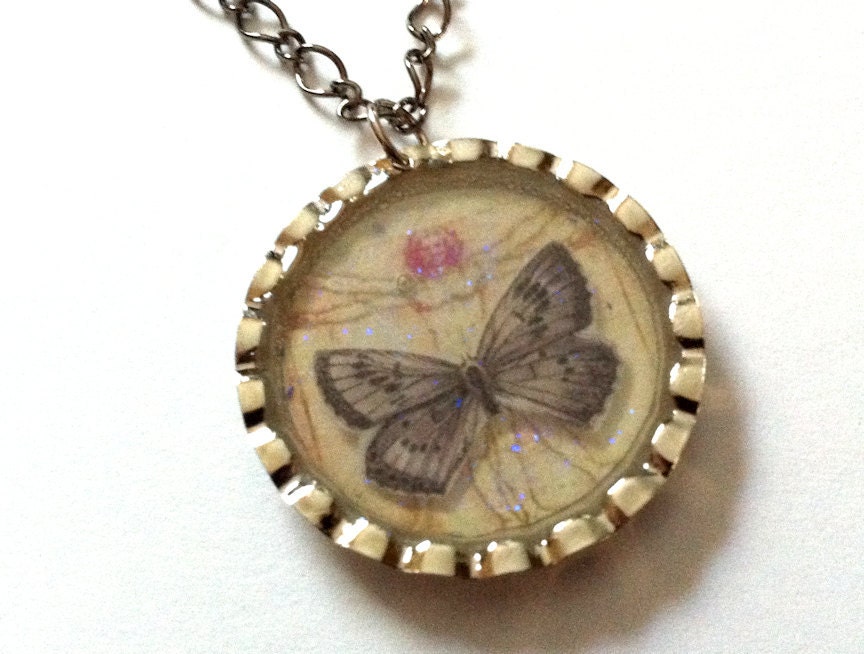 Butterfly Vitruvian Man Bottlecap Necklace by Everyday Bohemian. Silver & Gunmetal Grey