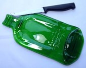 Flat Gordon's gin bottle cheeseboard with knife- flattened bottle, melted bottle