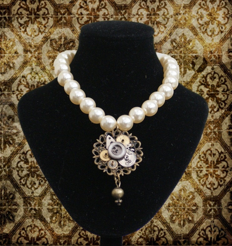 Pearl necklace with steampunk pendant made from vintage watch parts and a filigree mount