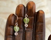 green heart dangle earrings.    925 Sterling silver wire wrapped glass beads. "unbroken hearts"