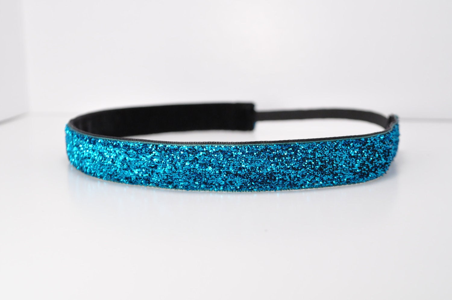 Band-It Headband.... Blue Glitter.  Will stay put and not slip.