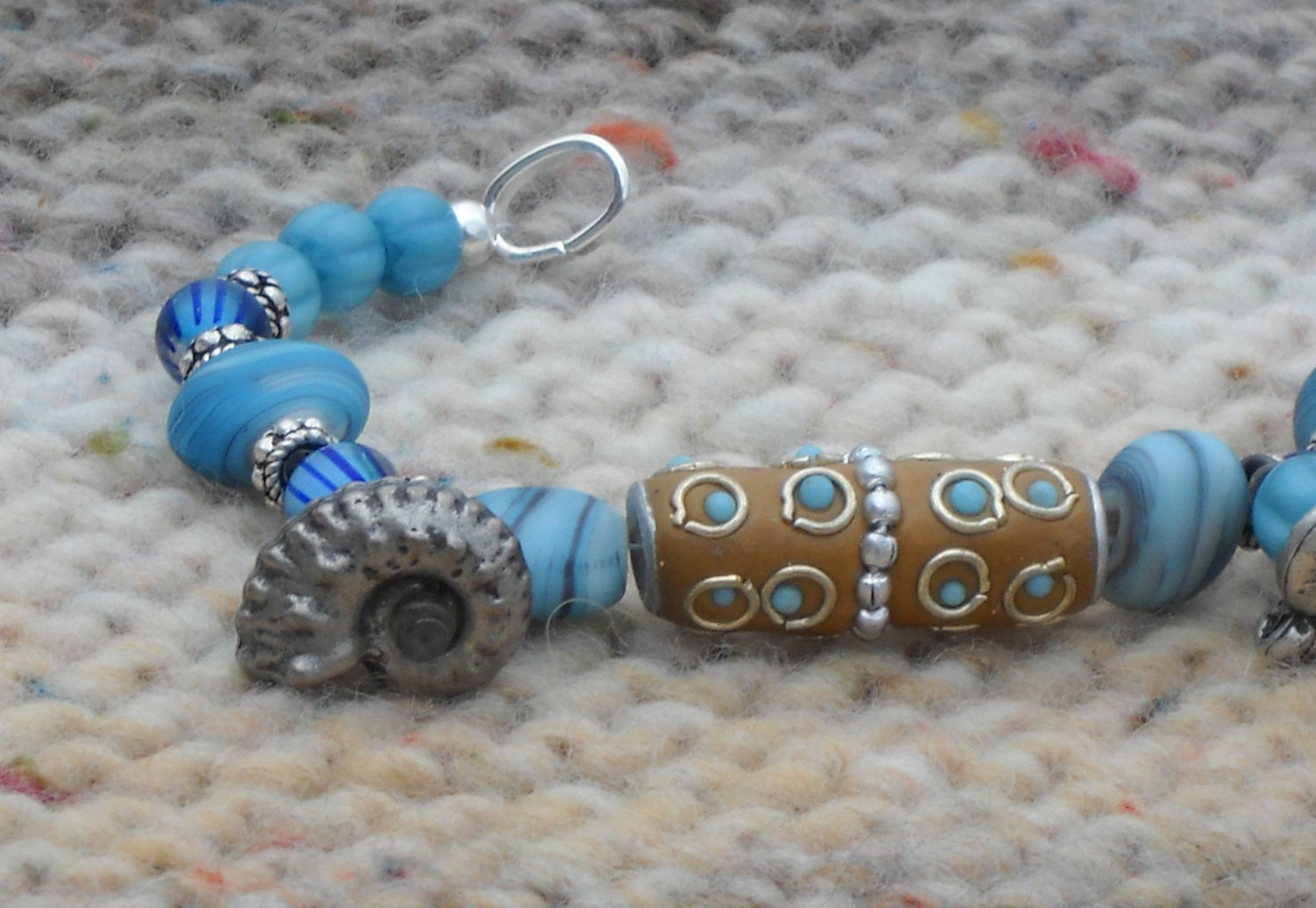 Blue Glass Beaded Bracelet with Nautilus Dangles