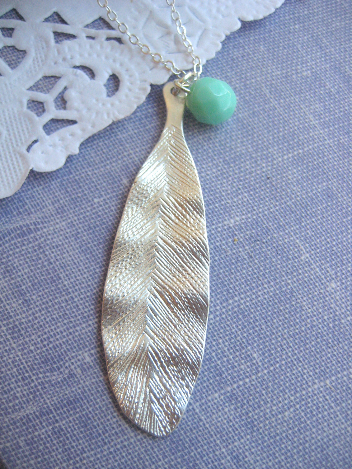 Flat leaf matte silver detailing seafoam coloured  czech glass faceted bead on silver plated chain necklace