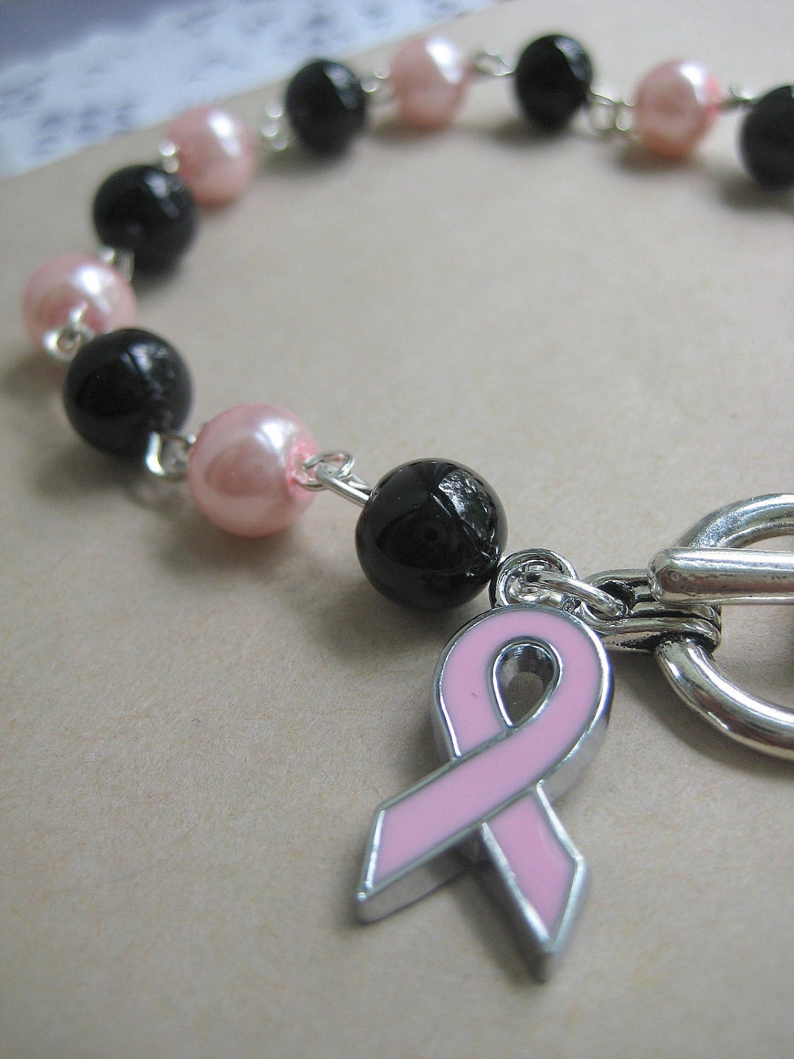 Breast Cancer pink black glass pearl bracelet pink enamel ribbon charm
