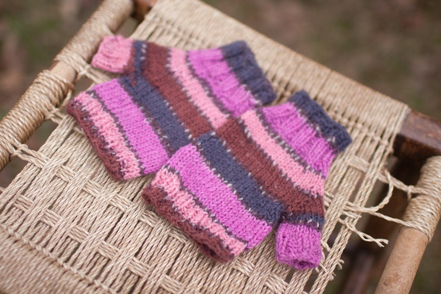 colorful fingerless gloves in pink, peach, blue and brown