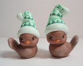 Pair of Snowbirds with blue stocking hats