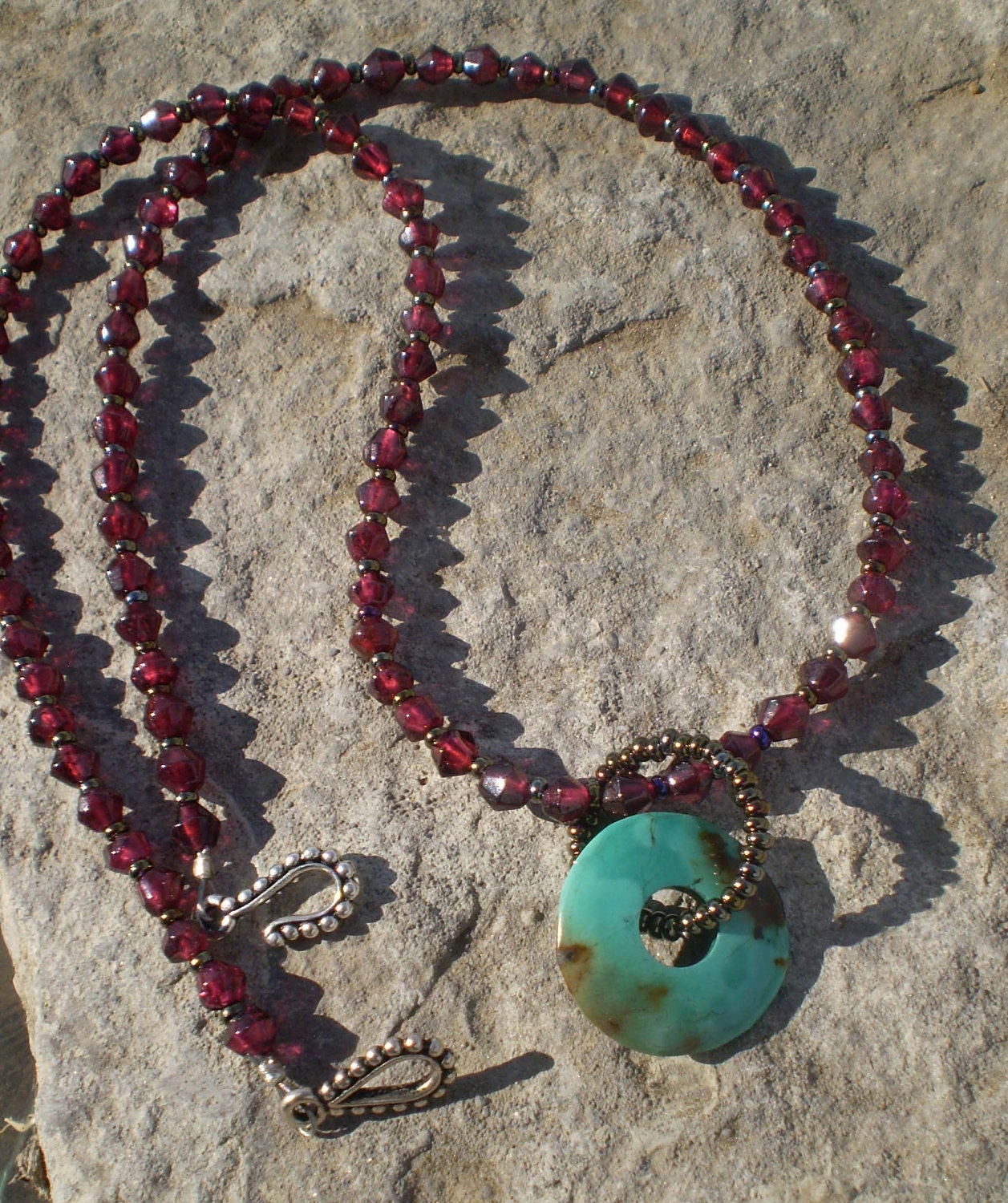 Garnet bicone beads with earthy chinese turquoise donut necklace