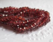 Soft Red Garnet  faceted rondelles, 3mm, half strand
